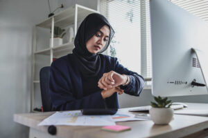 muslim businesswoman working with computer while sitting table office looking he 1 1